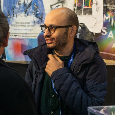 Hazem Berrabah sur le stand de l’AFC
 - Photo Marc Salomon

